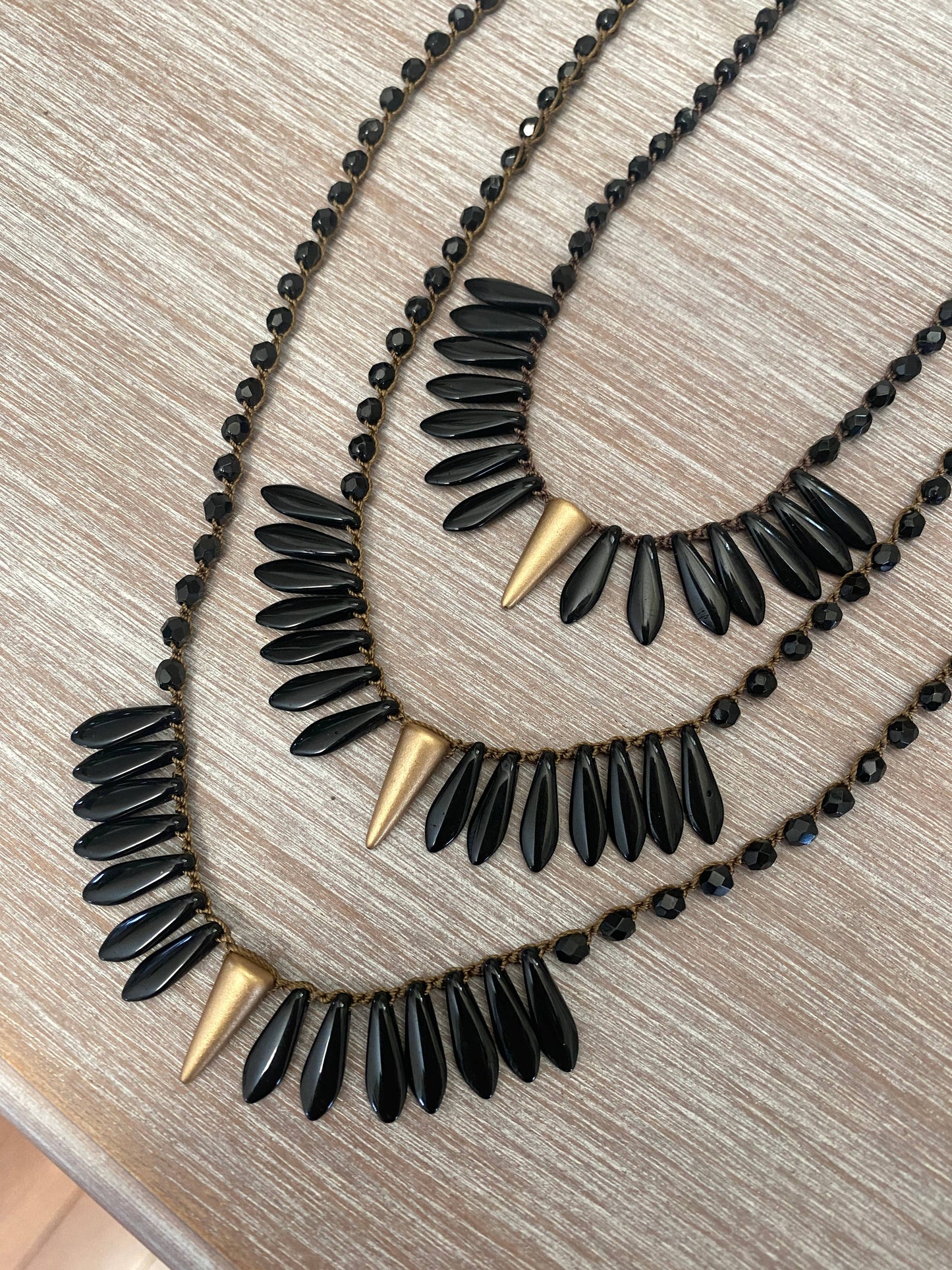 Thorn and Dagger Knotted Crystal Necklace In Black