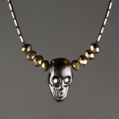 Hematite Skull w/ Gold Crystals & Crystal Eyes