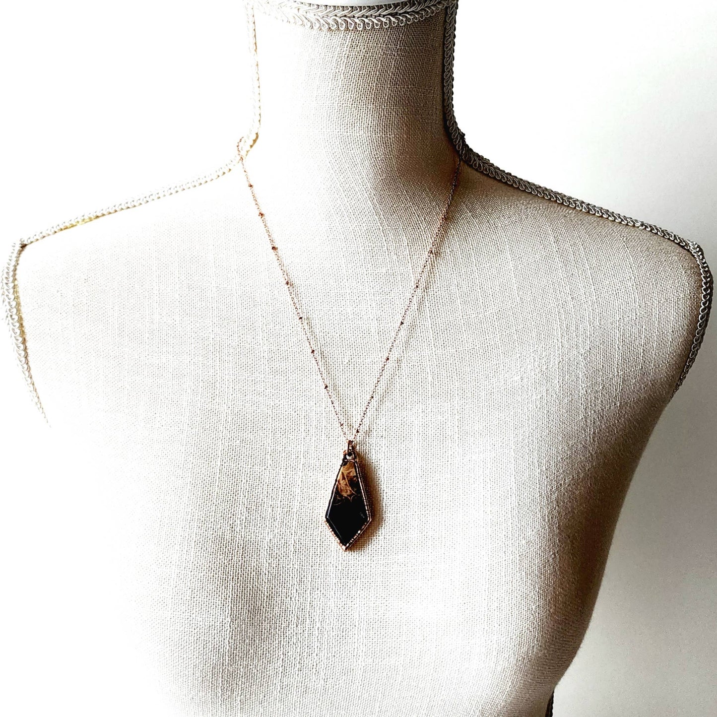 Fossilized Palm Wood Kite Necklace