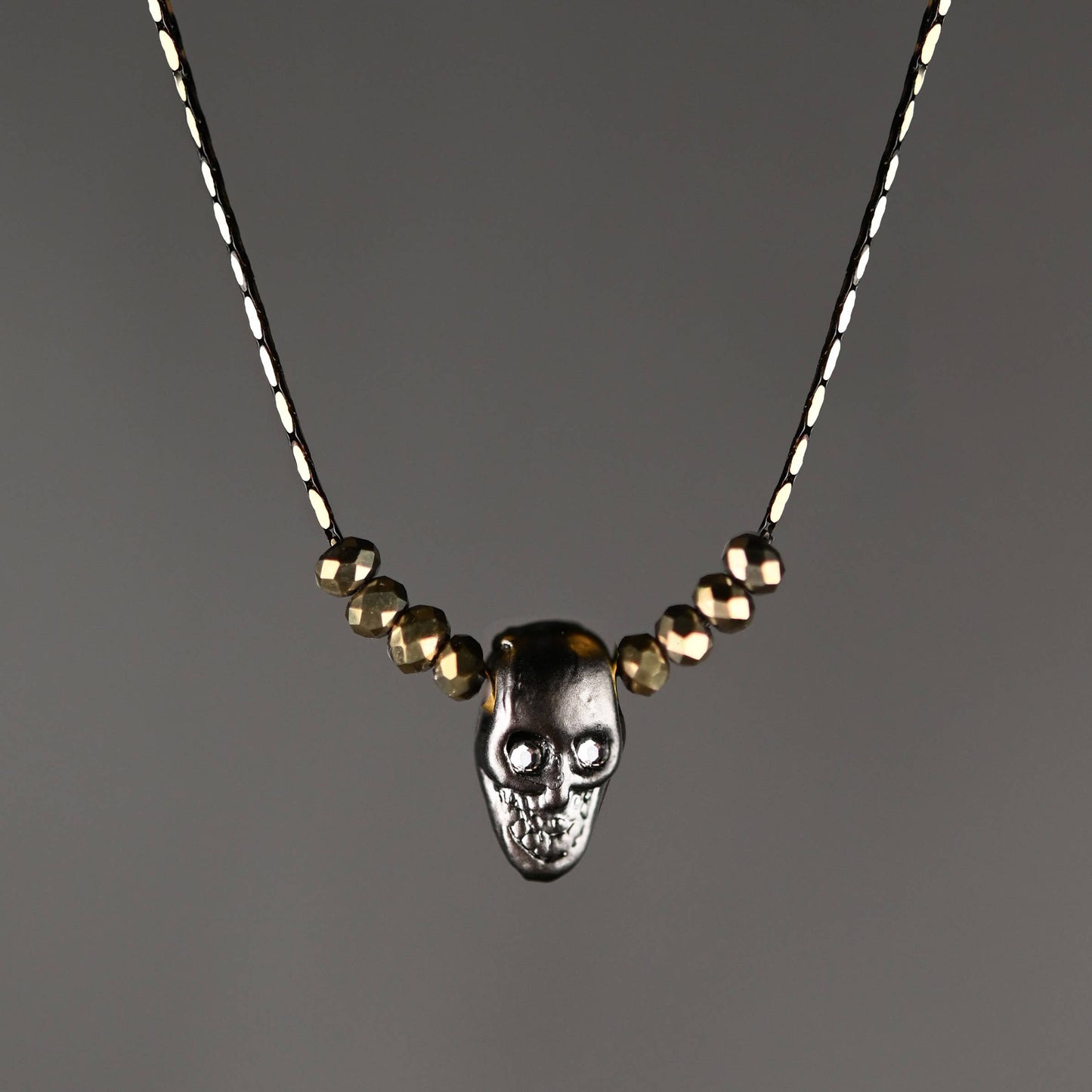 Hematite Skull w/ Gold Crystals & Crystal Eyes