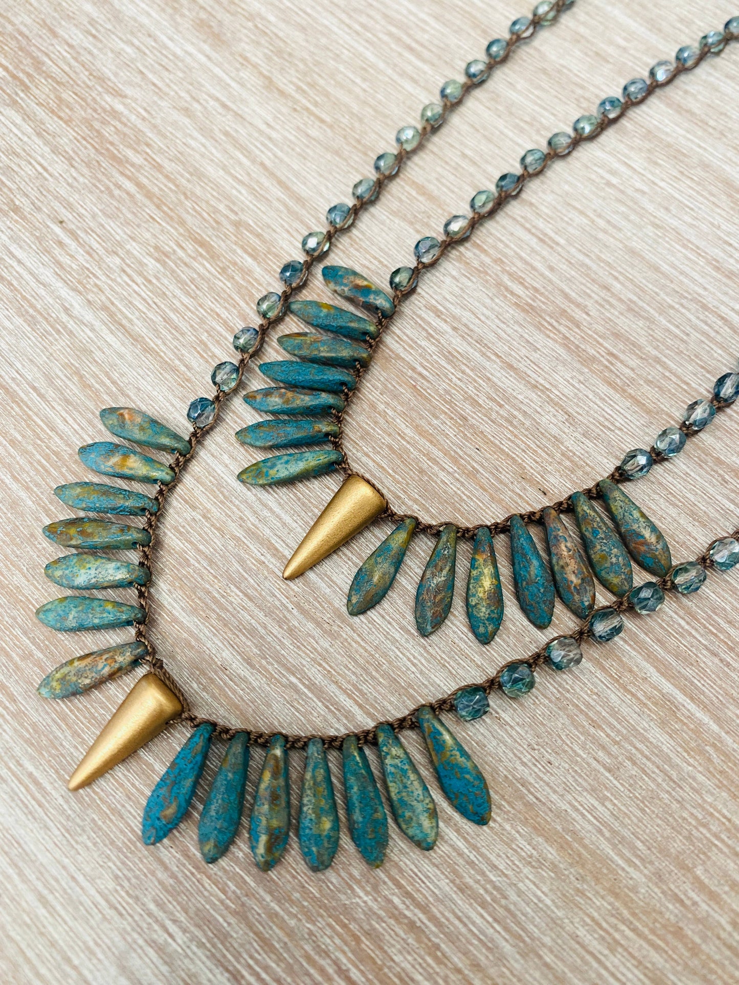 Thorn and Dagger Knotted Crystal Necklace In Deepwater Blue