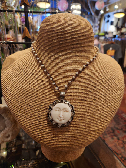 Carved Bone Sun Pendant on Beaded Necklace
